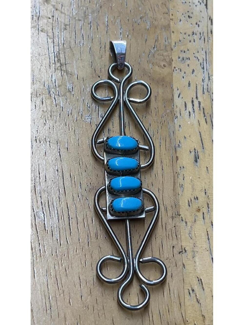 Native American Navajo jewelry handmade sterling silver tall turquoise pendant